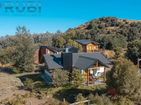 Complejo de 2 cabañas y galpón a orillas del rio chimehuin huechulafquen neuquén