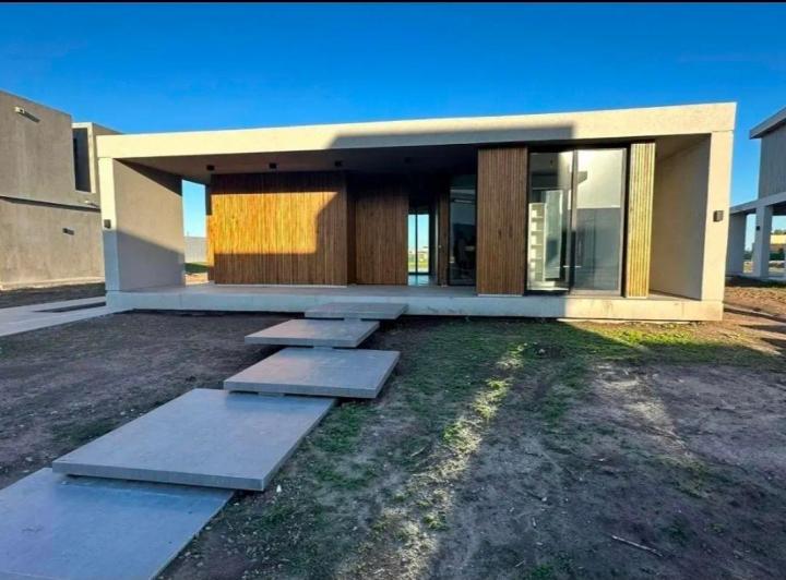 Casa · 125m² · 4 Ambientes · 2 Cocheras